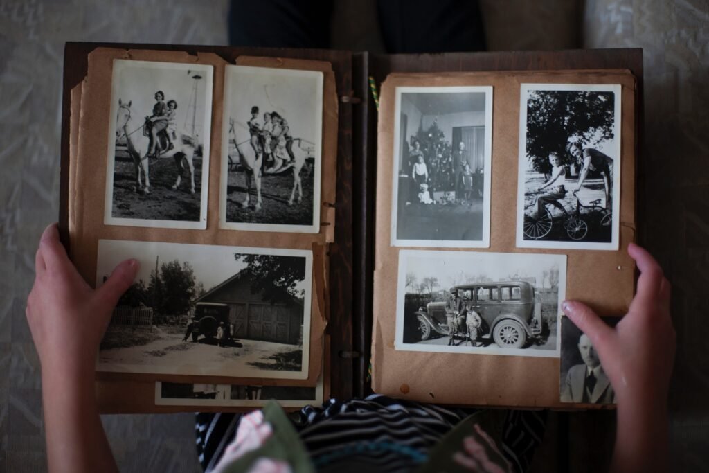 hands holding an old photo album. Taking a trip down memory lane