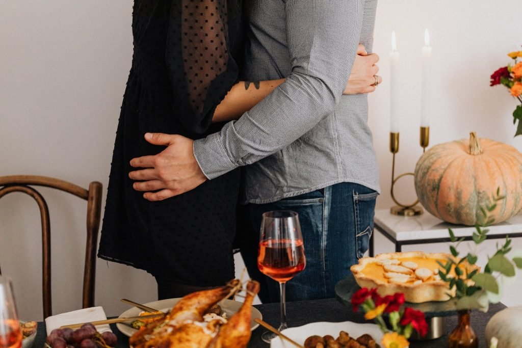 Couple Cuddle During Dinner 