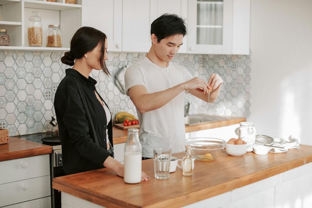 A Couple Preparing Food in the Kitchen