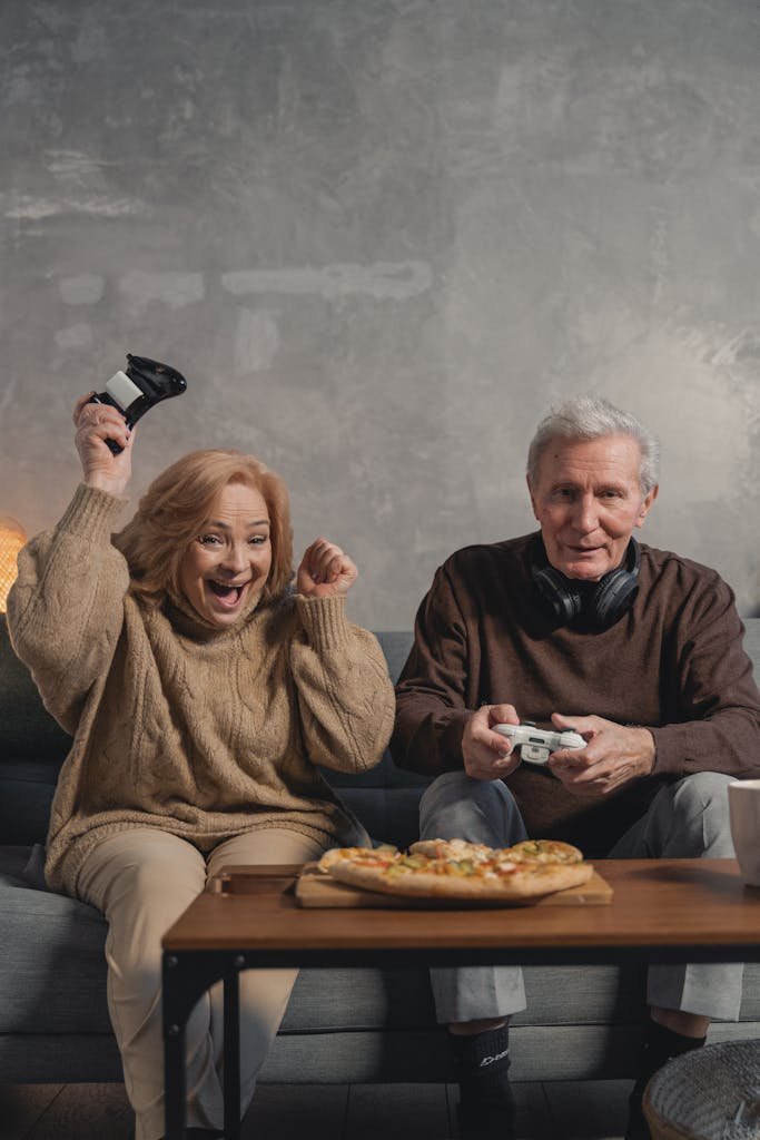 Man in Black Sweater Sitting Beside Woman in Brown Sweater