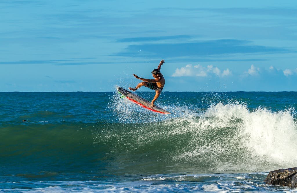 Man Surfing during Day