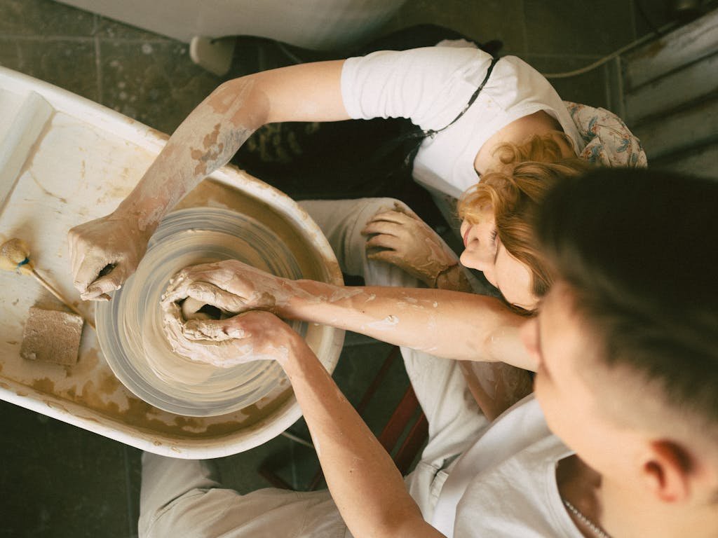 Young People Taking Part in Pottery Class