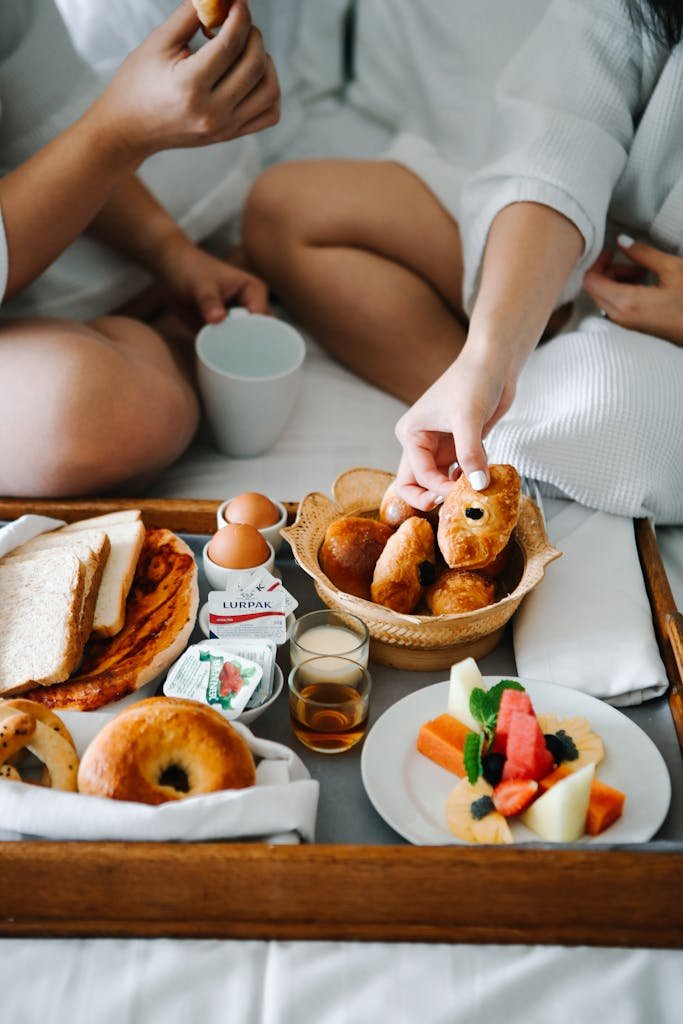 Couple Eating Breakfast on the Bed