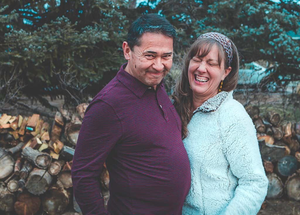 Selective Focus Photography of Man Beside Smiling Woman