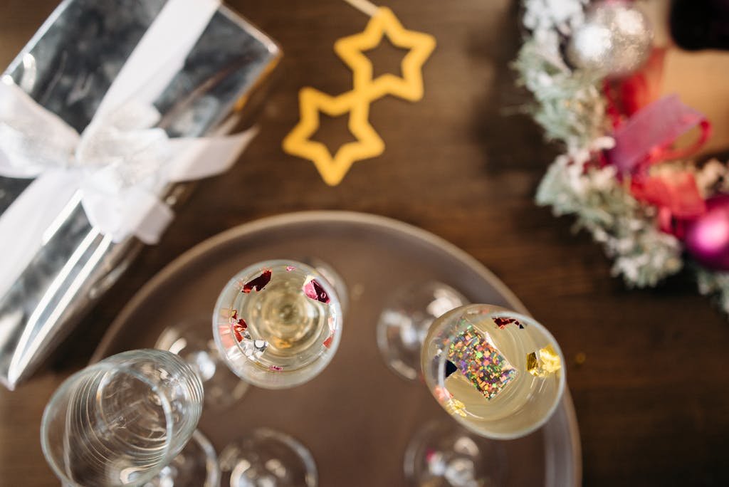 Clear Drinking Glasses on Brown Wooden Table