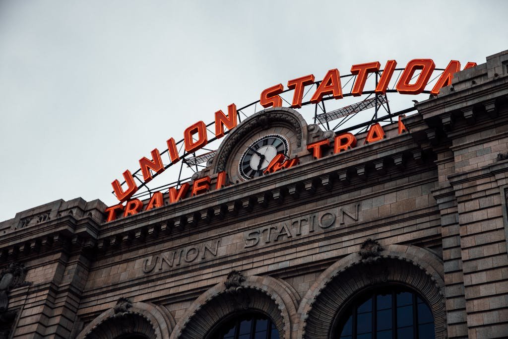 Iconic Union Station facade with clock and signage in Denver, Colorado, USA.