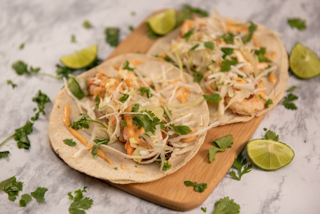 Authentic shrimp tacos with lime and cilantro garnish, perfect for a tasty Mexican dish.