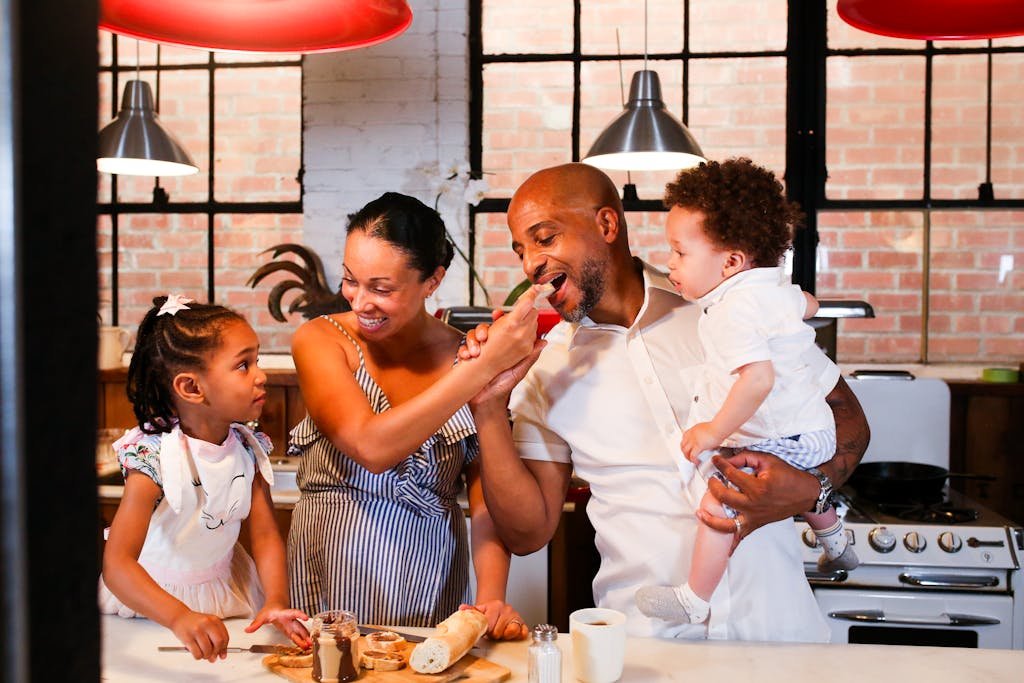 Family enjoying quality time cooking and having fun in the kitchen.