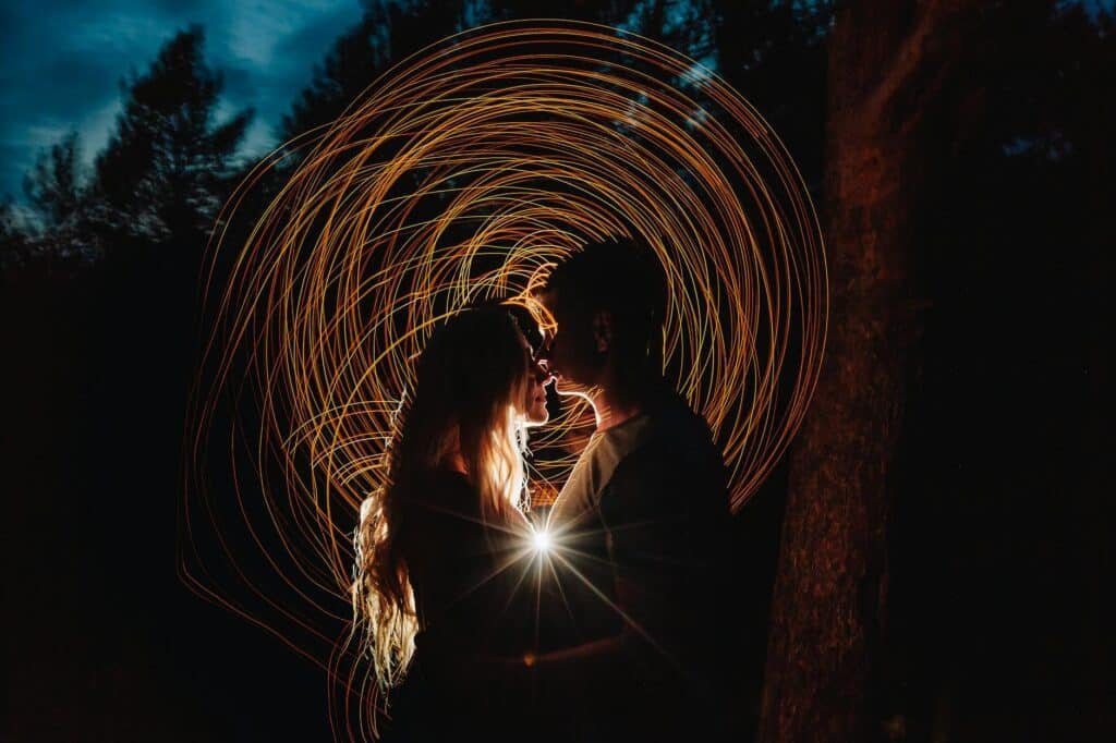 Couple on an outdoor low-energy date with sparks flying