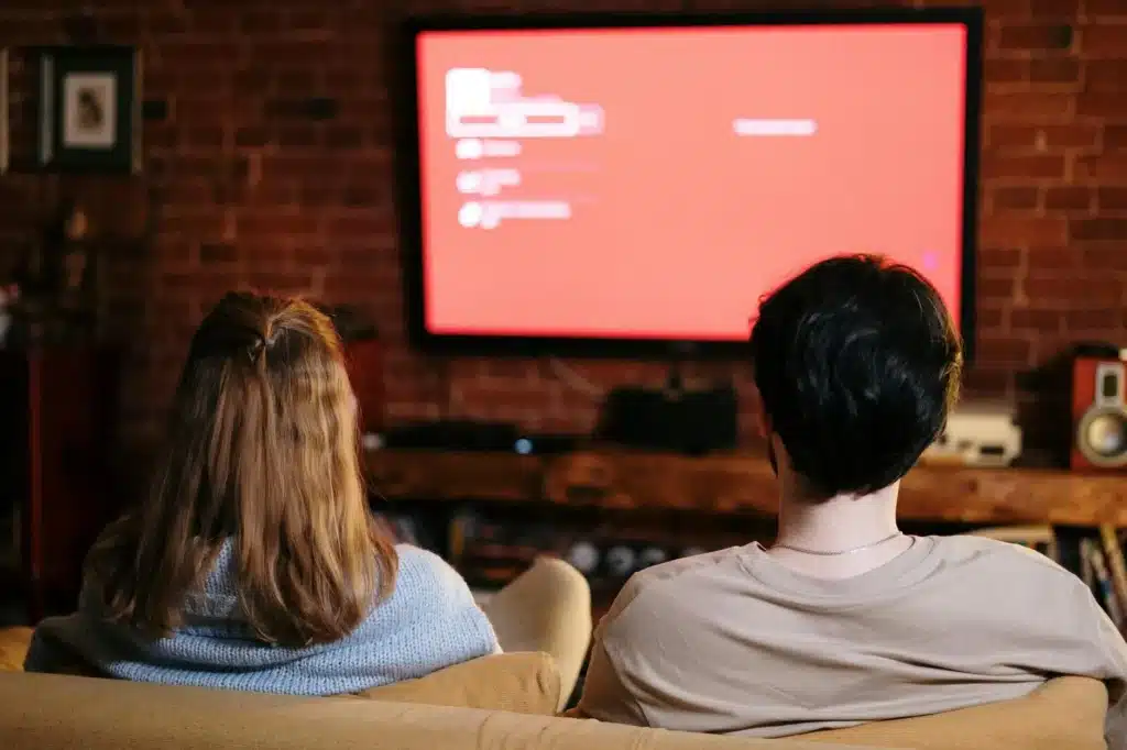 Too Tired for Date Night? Try These Relaxing Ideas! 7 couple on the sofa watching TV
