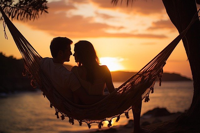 Monthly Date Night Rituals To Boost Your Relationship 6 couple cuddling in a hammock