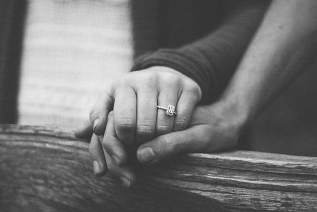 couple holding hands on a self care date