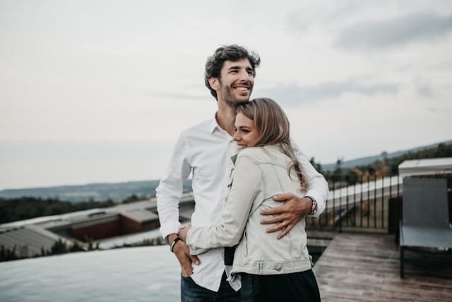 couple hugging on a self care date
