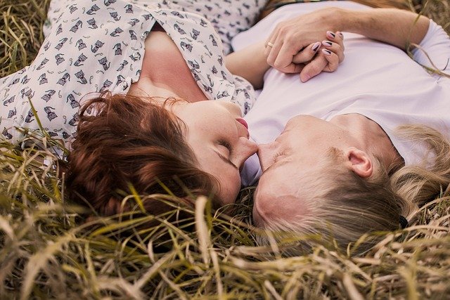 Monthly Date Night Rituals To Boost Your Relationship 3 couple laying in the grass close