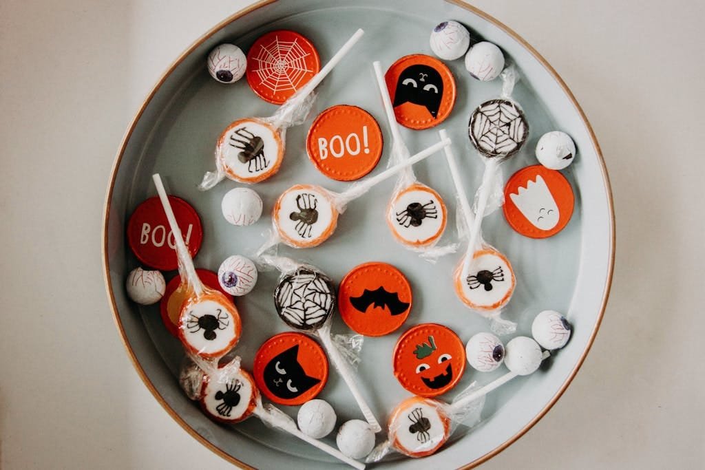 A vibrant assortment of Halloween-themed candies in a bowl, perfect for seasonal celebrations.